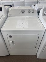 White Whirlpool front-loading dryer with control panel on top; sale sign reading 'SALE PRICE $295' on the lid.