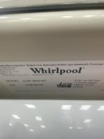 Whirlpool nameplate on a metal surface listing model and electrical specs (close-up).