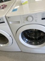 5ea9bbe0-1474-4c0c-914c-6b3a3d37bc5e-663-0000012ca85cd6e6_file - Discount Appliances Front-loading LG washing machines in a showroom, showing control panels and doors with glass windows.