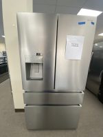 img_5097 - Discount Appliances Stainless steel Hisense side-by-side refrigerator with water/ice dispenser on the left door and a sale price note on the right door.