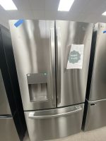 img_5099 - Discount Appliances Stainless steel French-door refrigerator with a water/ice dispenser on the left door; a sale tag on the right door reads 'Sale!!! $1,250'.