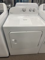 Whirlpool top-load washing machine with a sale price card reading $295.00 on the lid.