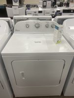 img_5140-3 - Discount Appliances White Whirlpool clothes dryer in a showroom, price sheet reading 'SALE PRICE $250.00' on the drum, surrounded by other laundry appliances.