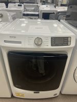 img_5900 - Discount Appliances Front view of a white Maytag washing machine in a showroom, with a sale price sign on top reading $450.00.