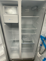 Open double-door refrigerator with ice maker on the left and empty shelves on both sides, including a few clear drawers at the bottom.