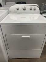 Front view of a white Whirlpool top-loading washing machine with three control dials and a sale price card on the lid reading $225.00.