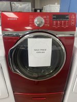 Red Samsung front-loading laundry dryer on display with a white sale price tag reading $250.00 on the door.