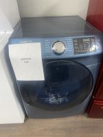 Samsung front-loading washing machine with a sale sign showing $295 in front of it.