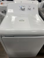 White top-loading washing machine with a sale-priced label on the lid reading 'SALE PRICE $295.00'
