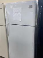 White refrigerator with a paper sale tag reading 'SALE PRICE $250.00' attached to the door.