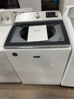img_0013-2 - Discount Appliances Maytag top-load washing machine with a sale price sheet placed on the open lid area.