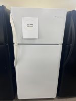 White refrigerator with a sale-price note reading $250.00 attached to the door in a showroom