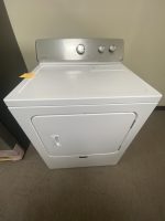 img_7685 - Discount Appliances White front-loading? Actually top-loading washer: a white top-load washing machine with a metal control panel and three knobs, against a beige wall.