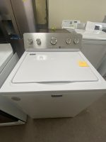 img_7687 - Discount Appliances Front-loading Maytag top-load washer with control panel and lid closed; in a laundry appliance showroom.