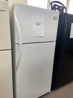 White refrigerator in a store with a paper sale price sign reading 'SALE PRICE $250.00' on the door.