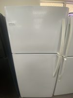 Light gray Frigidaire two-door refrigerator with a vertical right-side handle visible on the top door panel.